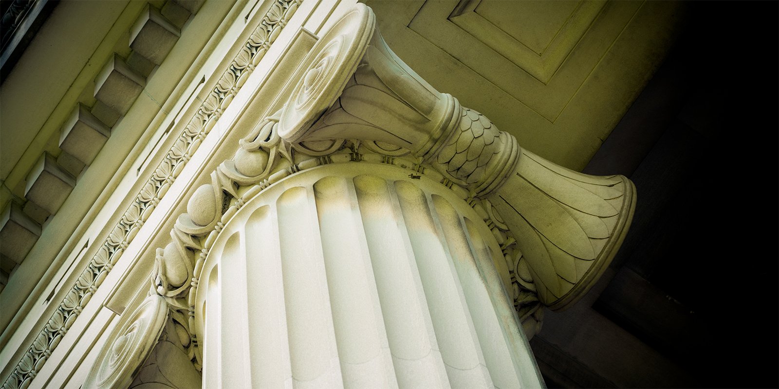 Classical architectural column symbolizing strength and justice, representing Atlas Air's victory in federal court against mass-action litigation over its COVID-19 vaccine policies.